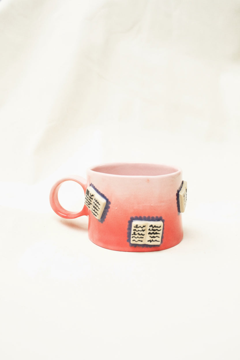 books + gradient coffee cup (rouge/baby pink)