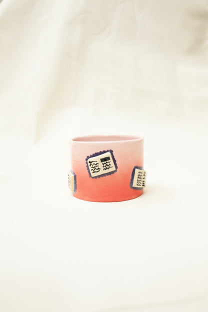 books + gradient coffee cup (rouge/baby pink)