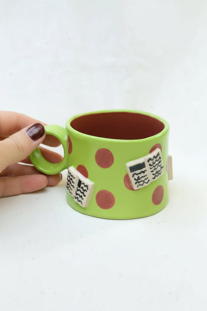 books + polka coffee cup (chartreuse/plum)