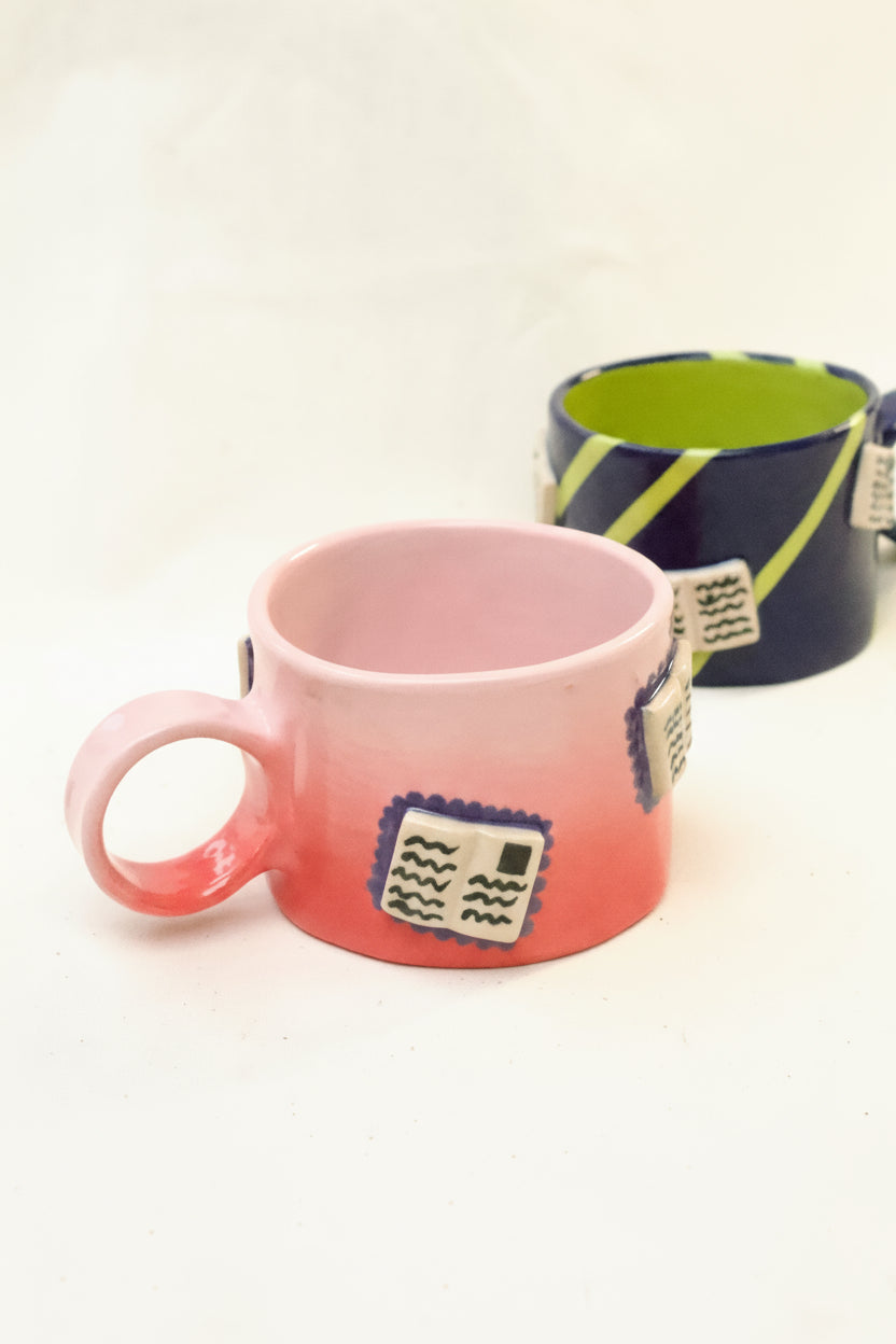 books + gradient coffee cup (rouge/baby pink)