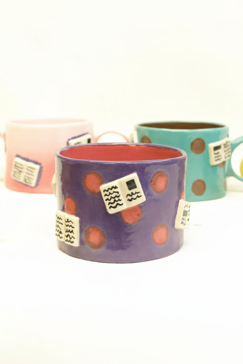books + polka mug (amethyst/ruby)