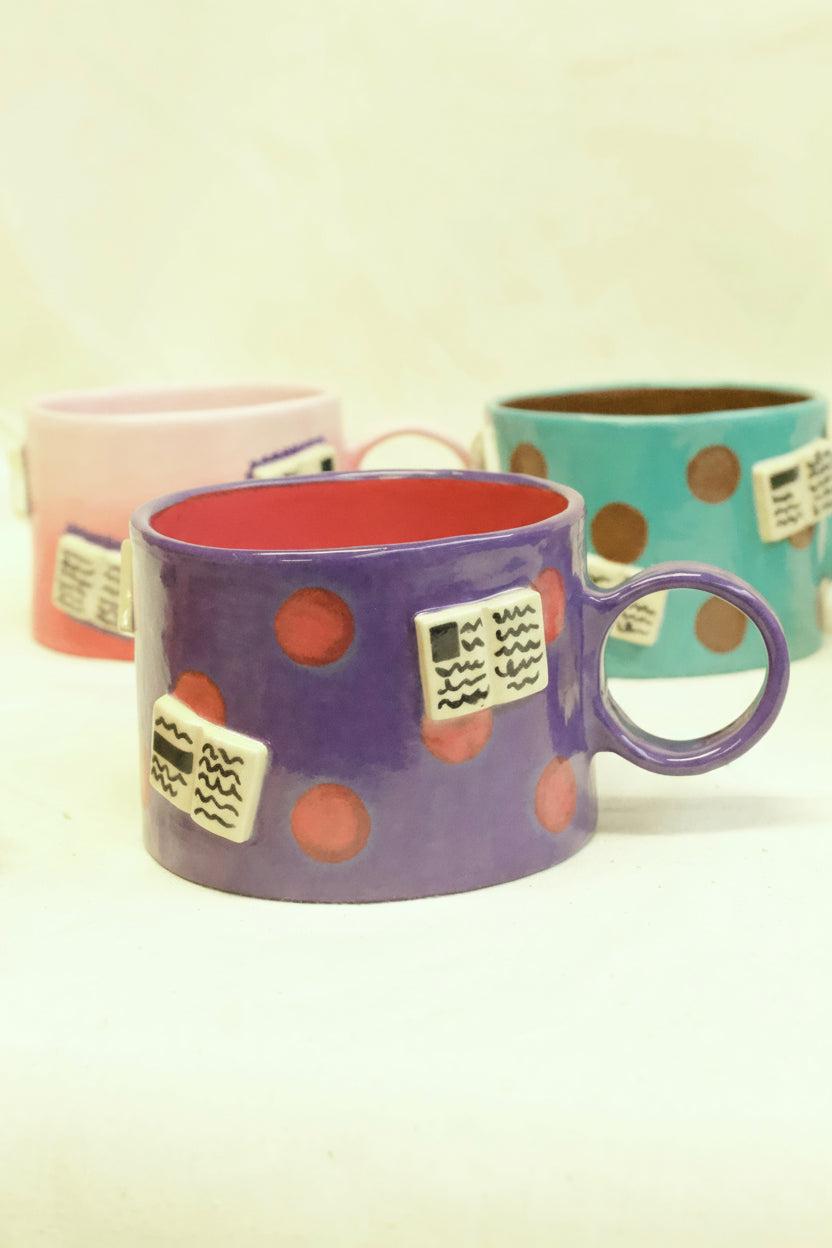 books + polka mug (amethyst/ruby)